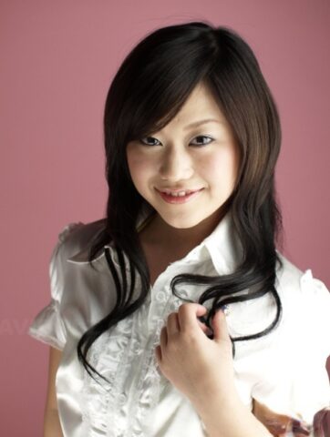 Cute Japanese model Minako Oyama poses non nude in a blouse and skirt