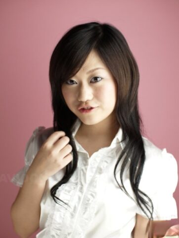 Cute Japanese model Minako Oyama poses non nude in a blouse and skirt
