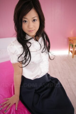 Cute Japanese model Minako Oyama poses non nude in a blouse and skirt
