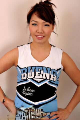 Amateur Asian solo girl sheds cheerleader uniform to bare tiny teen tits