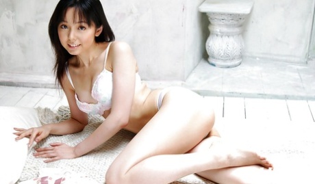 Foxy asian babe Yui Hasumi stripping off her lingerie on the bed