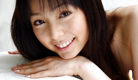 Foxy asian babe Yui Hasumi stripping off her lingerie on the bed