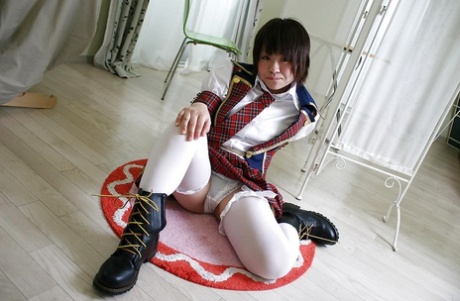 Asian schoolgirl Mayu Nakane revealing her nice ass and inviting gash