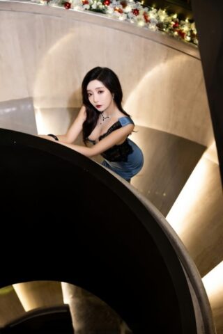 Hot Asian girl teases while posing at various locations while fully clothed