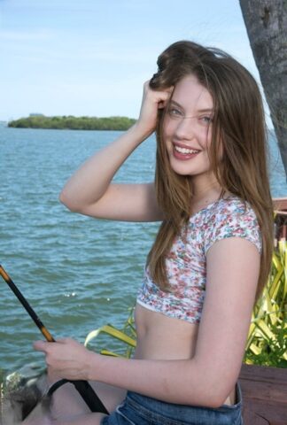 Charming teen Elena Koshka shows off her small tits & spreads her shaved pussy