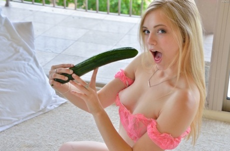 Petite blonde bimbo slides a banana and a cucumber in her tight muff