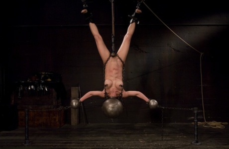 Petite Asian slave girl Tia Ling gets suspended and humiliated by her master