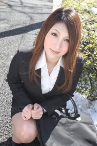 Hot redhead Japanese girl in suit poses to show her beautiful face