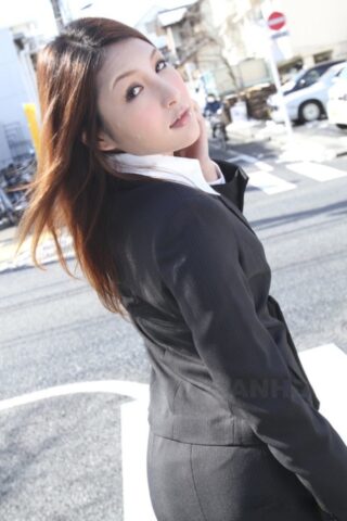 Hot redhead Japanese girl in suit poses to show her beautiful face