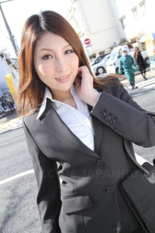 Hot redhead Japanese girl in suit poses to show her beautiful face