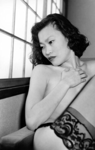 Asian babe shows her petite body & her tiny tits in a black & white scene