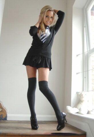 Long legged blond babe Becky Roberts posing in knee high stockings