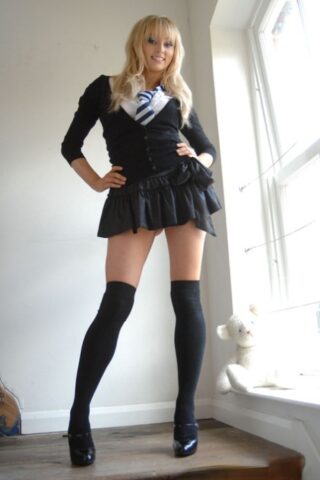 Adorable babe in black socks Elle Parker taking off her school uniform