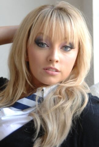 Adorable babe in black socks Elle Parker taking off her school uniform