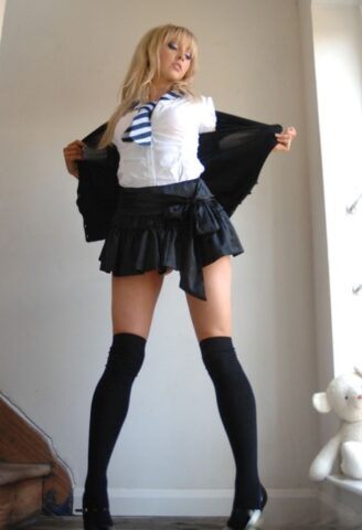 Adorable babe in black socks Elle Parker taking off her school uniform
