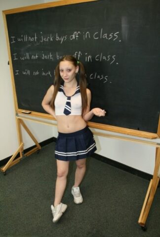 Little teen giving her tall blonde teacher a great handjob in the classroom