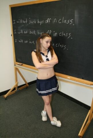 Little teen giving her tall blonde teacher a great handjob in the classroom