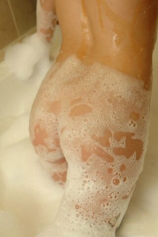Flat chested Diddylicious sheds her bikini in the bath showing soapy hot ass
