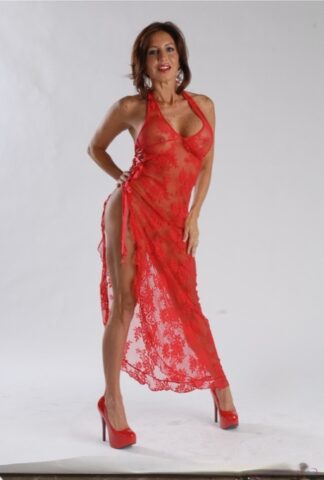Cougar Tara Holiday flashes her tits and pussy while posing in her sheer dress