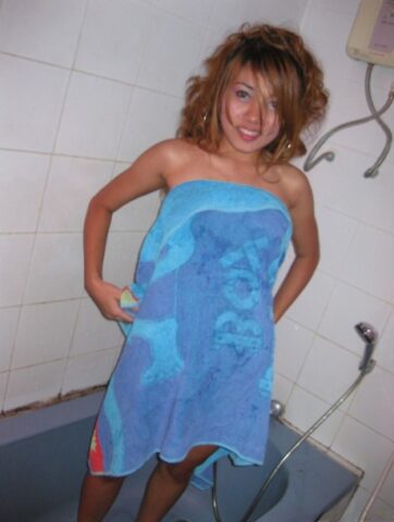 Cute Thai girl with a shaved pussy takes a shower before sex with a Farang