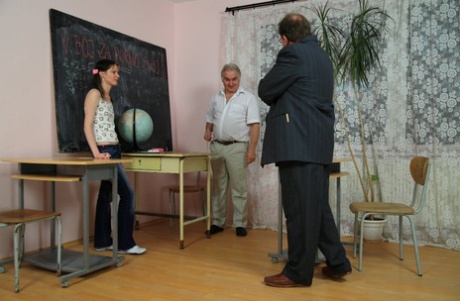 Hot pigtailed teen Iren gets spit roasted by two old teachers in the classroom