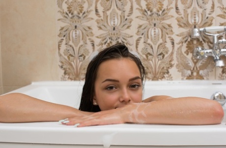 Beautiful teen babe Slava shows her hot body during her bubble bath