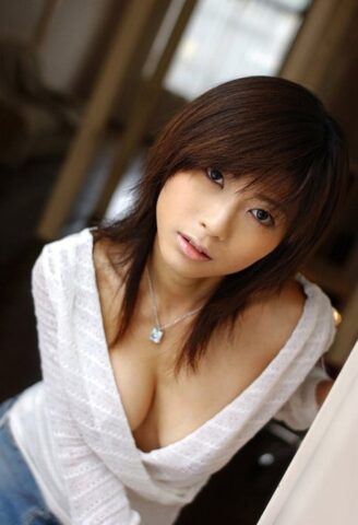 Beautiful Japanese girl Rin Suzuka lets a firm breast loose during solo action