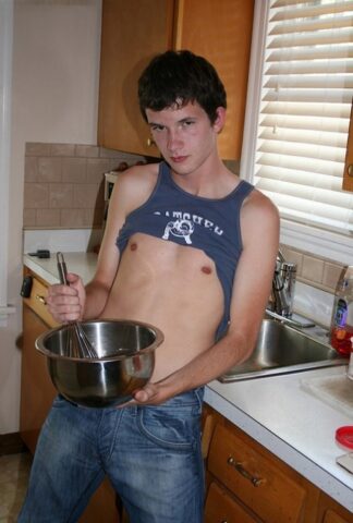 Naughty gay Devin Moss strips naked & jerks his big dick while baking
