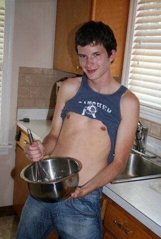 Naughty gay Devin Moss strips naked & jerks his big dick while baking