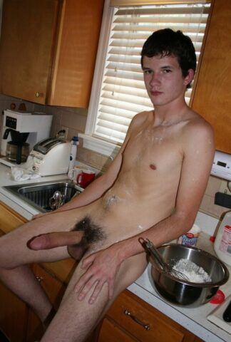 Naughty gay Devin Moss strips naked & jerks his big dick while baking