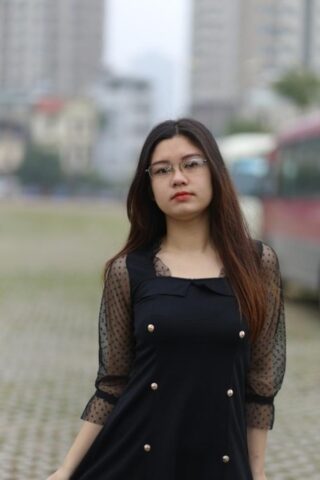Pretty Asian model Natalia posing in her lovely black outfit outdoors