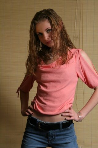 Skinny babe Lil Candy shows her tiny boobs while posing in her winter jacket