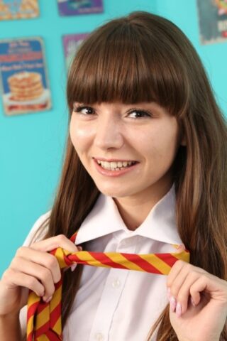 78003396_050_7f42 Adorable brunette teen Helen G strips to yellow nylons and poses topless
