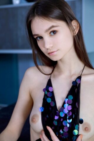 Glamorous babe Anastasia Bella unveils her small tits & her shaved pussy