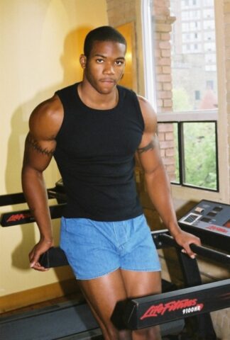 Black gay with hot muscles Houston A exposes his big prick after a gym workout