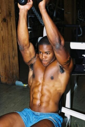 Black gay with hot muscles Houston A exposes his big prick after a gym workout