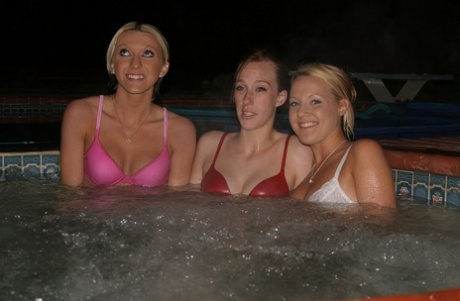 Lesbian teens Cari, Nadia, and Vanessa strip and pose naked in the jacuzzi