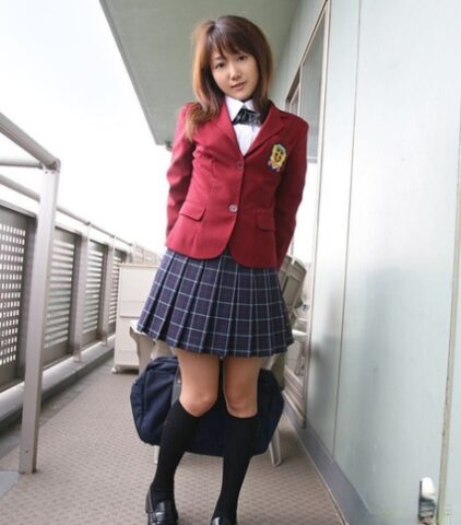 Lusty asian coed in uniform flashing her panties and tiny tits
