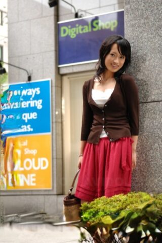 Japanese beauty Mio Kanna strolls downtown in a knee-length skirt