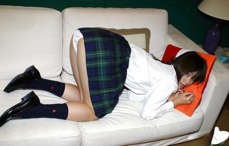 Naughty asian schoolgirl Hikaru Koto slipping off her uniform