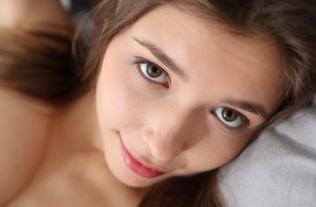 Lovely Ukrainian babe Mila Azul teases with her beautiful big tits on her bed