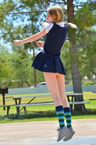 Skinny pantyless teen Sharlotte flashing her clit in public and stripping